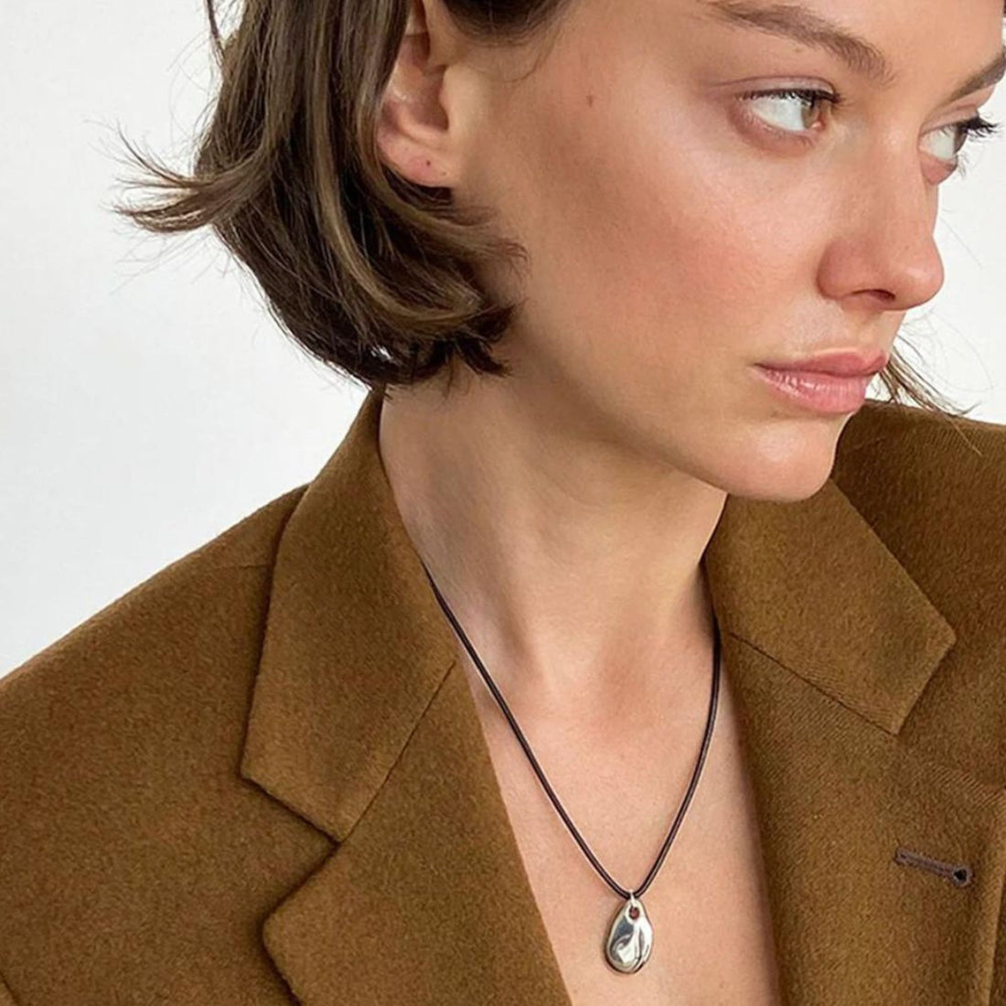 Small Pebble Pendant Necklace Silver Cord